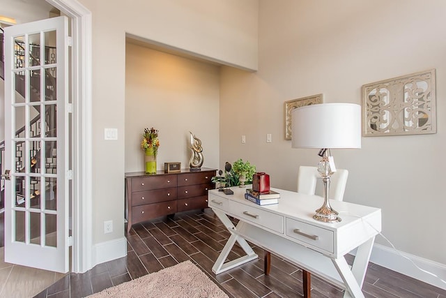 home office with wood tiled floor and baseboards