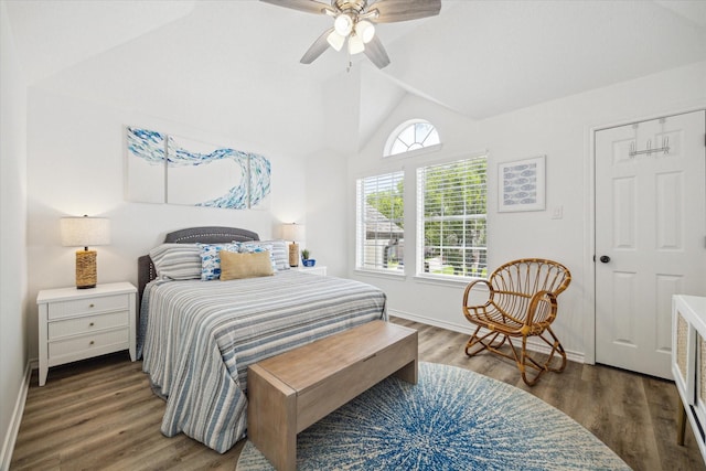 bedroom featuring vaulted ceiling, a ceiling fan, wood finished floors, and baseboards