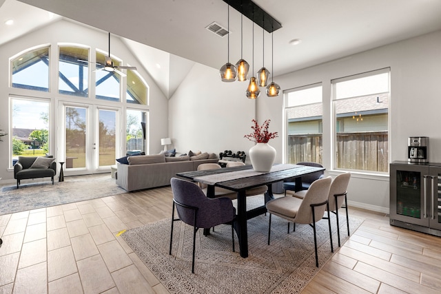 dining area featuring light wood-style flooring, visible vents, and plenty of natural light