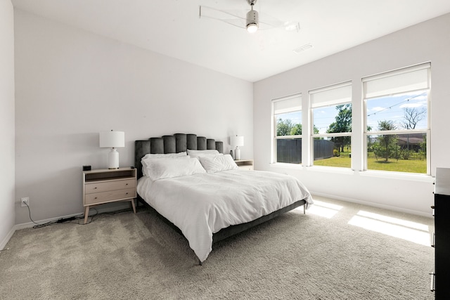carpeted bedroom with visible vents and baseboards