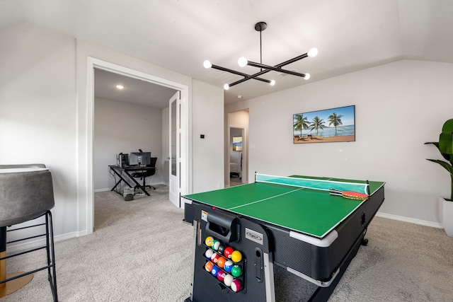 playroom featuring lofted ceiling, baseboards, carpet floors, and a chandelier