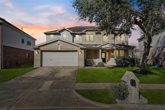 view of front of house featuring covered porch, a front lawn, driveway, and brick siding