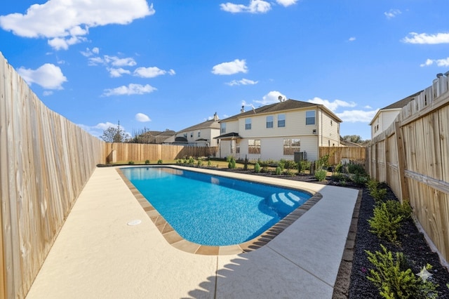 view of swimming pool with a fenced backyard and a patio area
