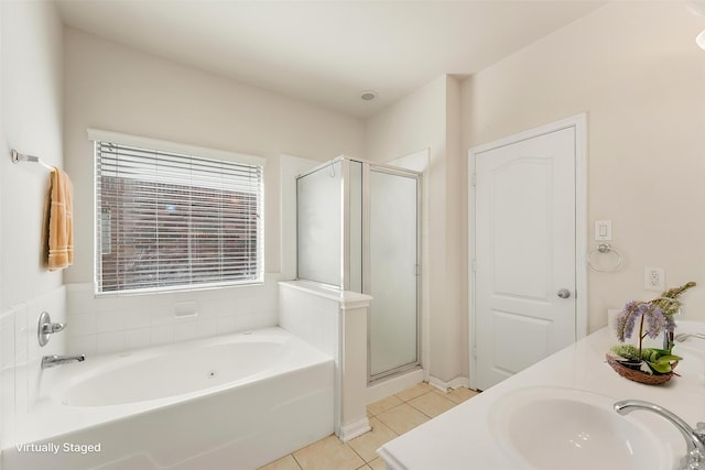 bathroom featuring tile patterned flooring, a shower stall, a bath, and double vanity