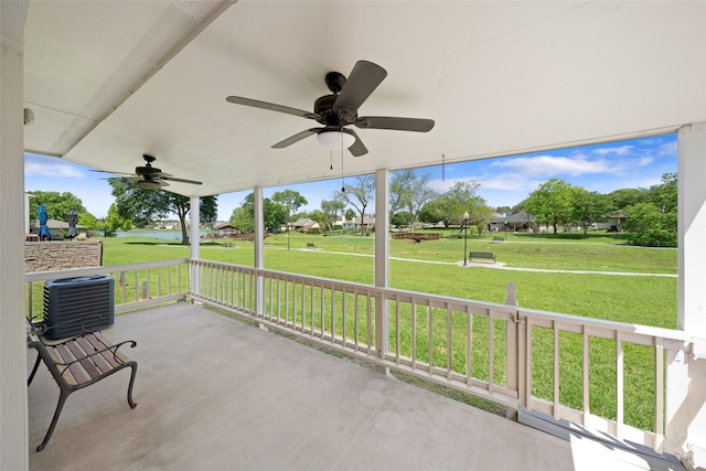 view of patio with a residential view, a ceiling fan, and central AC unit
