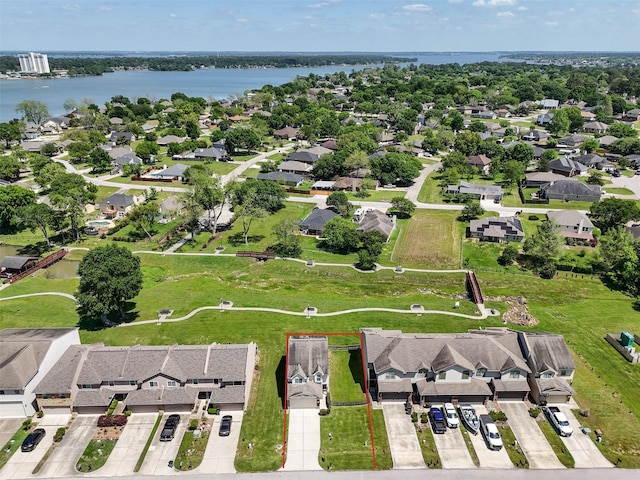 birds eye view of property with a residential view and a water view