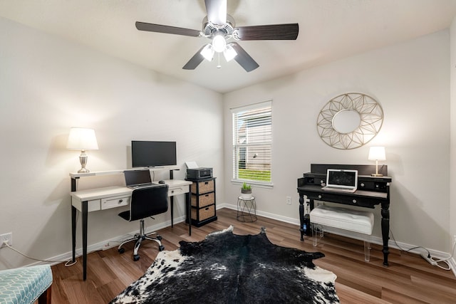 office area with ceiling fan, baseboards, and wood finished floors