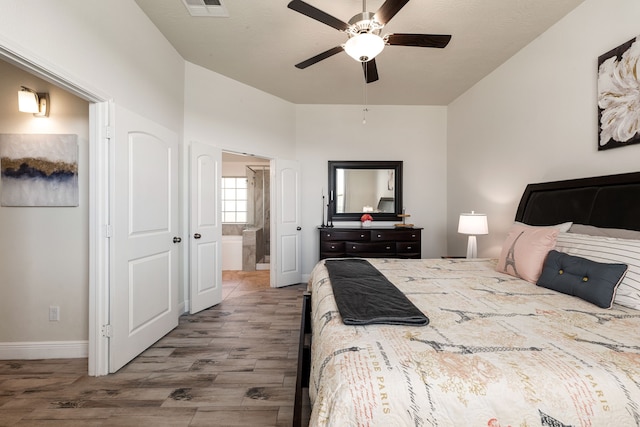 bedroom with visible vents, baseboards, a ceiling fan, and wood finished floors
