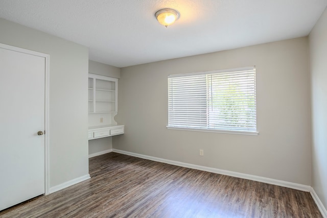 10610 Dunbrook Dr, Houston, TX 77070 - spare room featuring wood finished floors and baseboards