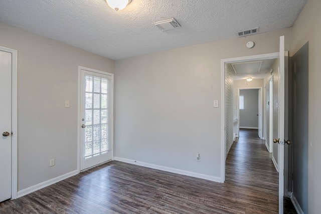 10610 Dunbrook Dr, Houston, TX 77070 - unfurnished room with attic access, visible vents, and dark wood-style flooring