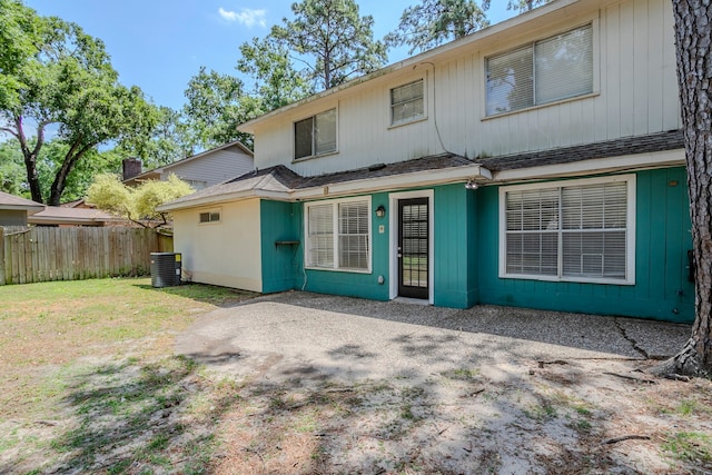 10610 Dunbrook Dr, Houston, TX 77070 - rear view of house with cooling unit, a patio, and fence