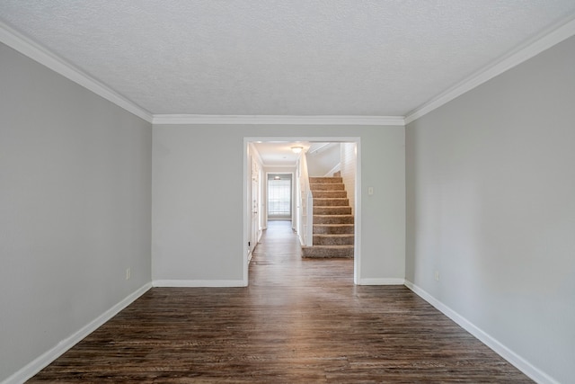 10610 Dunbrook Dr, Houston, TX 77070 - unfurnished room featuring baseboards, stairs, ornamental molding, and dark wood-style floors