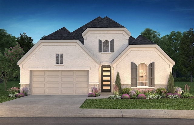 13136 Soaring Forest Dr, Conroe, TX 77302 - french country style house featuring driveway, a garage, and brick siding