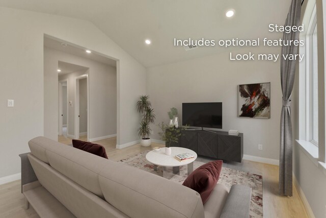 13136 Soaring Forest Dr, Conroe, TX 77302 - living area with wood finished floors, vaulted ceiling, recessed lighting, and baseboards