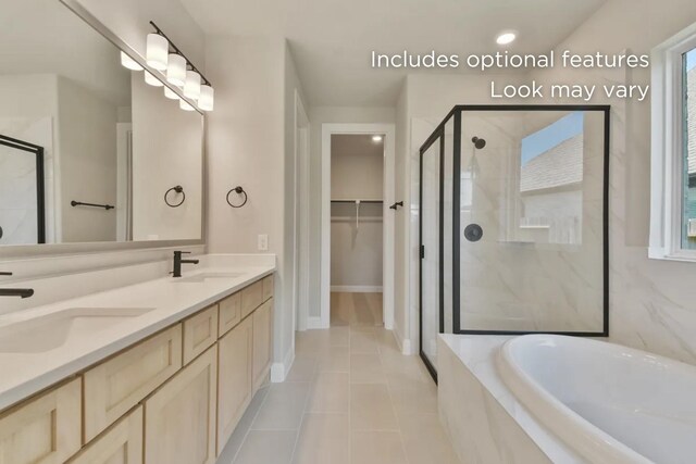 13136 Soaring Forest Dr, Conroe, TX 77302 - bathroom featuring a stall shower, a garden tub, double vanity, a spacious closet, and tile patterned flooring