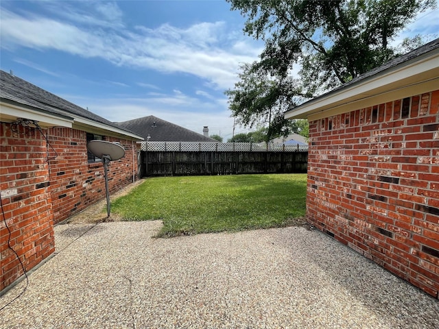 view of yard featuring a fenced backyard and a patio area