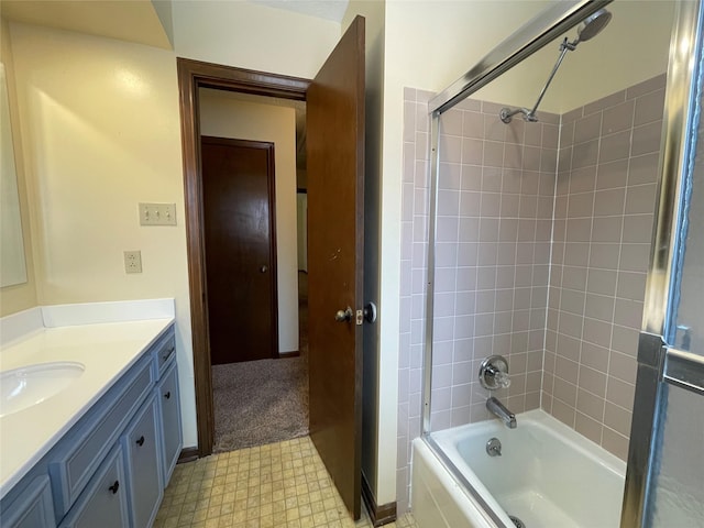 bathroom featuring tub / shower combination, tile patterned floors, and vanity