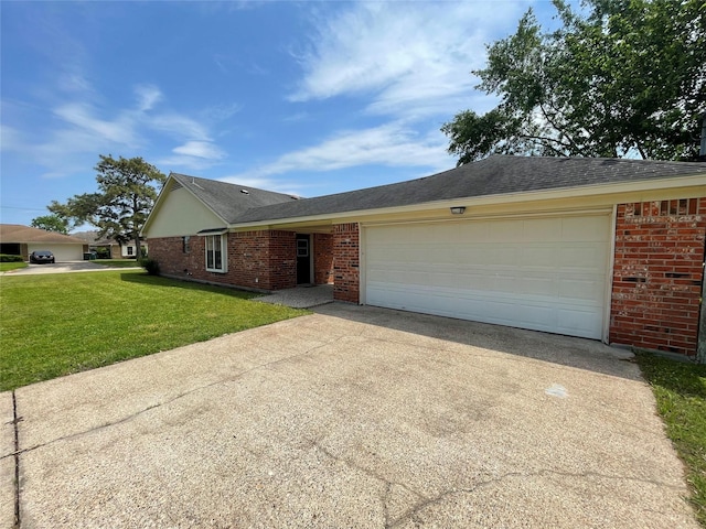 ranch-style house featuring a front lawn, brick siding, driveway, and a garage