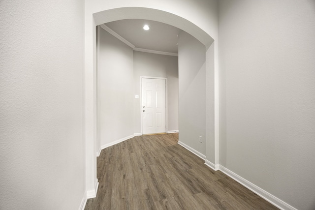 6723 Cypress Glades Dr, Katy, TX 77449 - hall with crown molding, arched walkways, baseboards, dark wood-type flooring, and recessed lighting