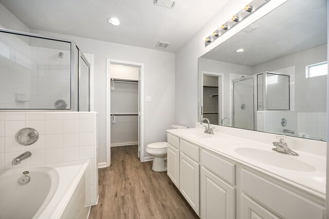 6723 Cypress Glades Dr, Katy, TX 77449 - bathroom with a bath, a sink, visible vents, and a stall shower