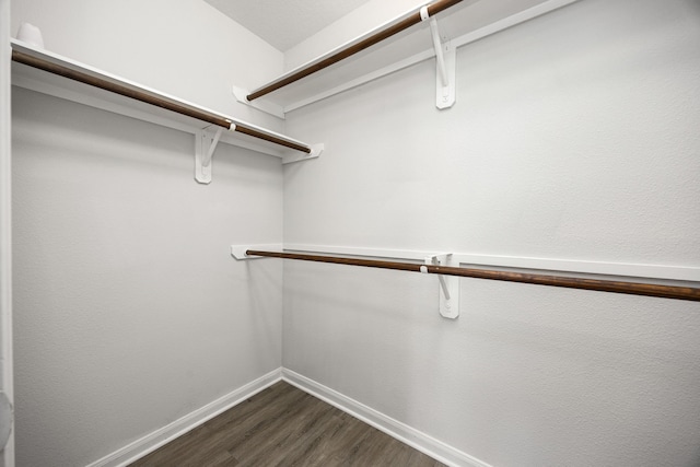 6723 Cypress Glades Dr, Katy, TX 77449 - walk in closet featuring dark wood finished floors