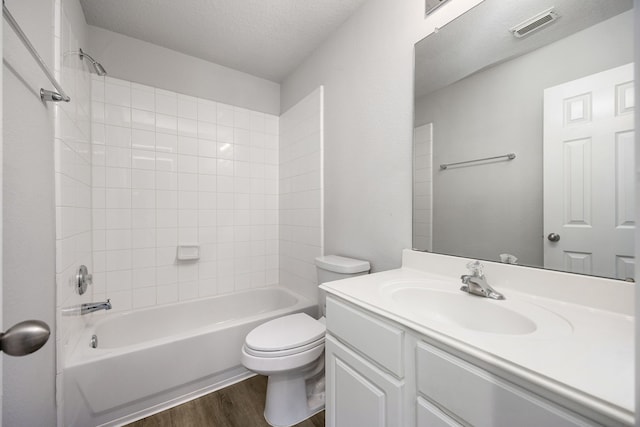 6723 Cypress Glades Dr, Katy, TX 77449 - full bath with wood finished floors, vanity, shower / tub combination, toilet, and visible vents