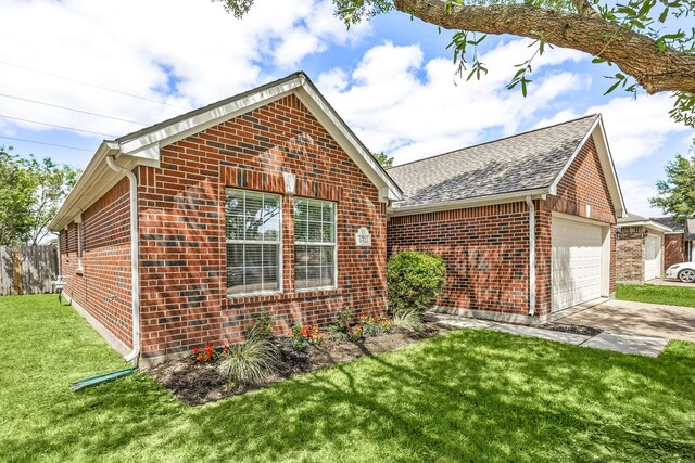 6723 Cypress Glades Dr, Katy, TX 77449 - view of home's exterior with concrete driveway, brick siding, fence, and a yard