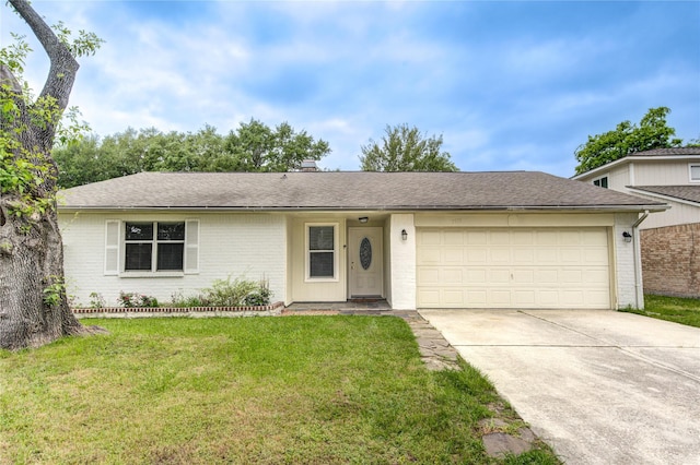 ranch-style house with concrete driveway, brick siding, a front yard, and a garage