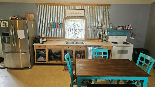 101 Plantation Dr, Waller, TX 77484 - kitchen featuring stainless steel appliances, light countertops, and a sink