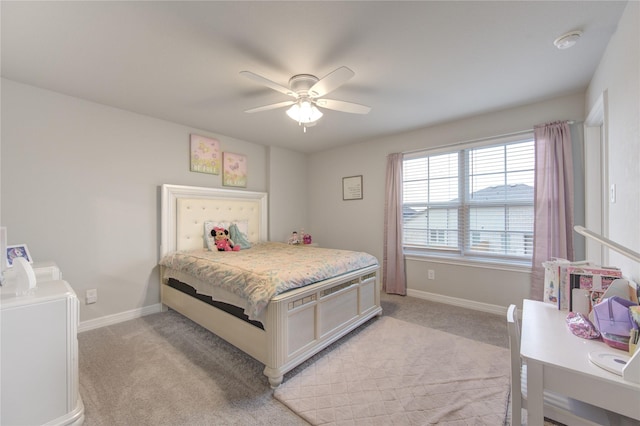 bedroom featuring baseboards, a ceiling fan, and light carpet