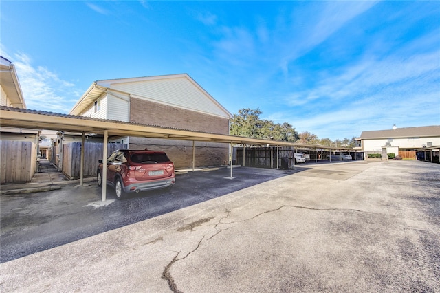 covered parking lot with fence