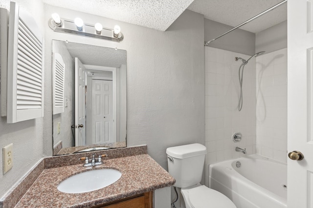 full bath with a textured ceiling, toilet, a textured wall, vanity, and tub / shower combination