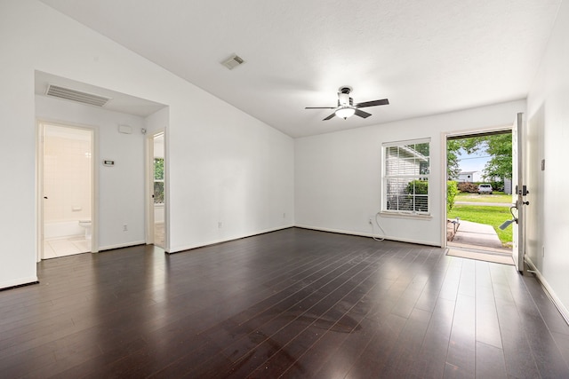 unfurnished living room featuring baseboards, a ceiling fan, dark wood-style flooring, and visible vents