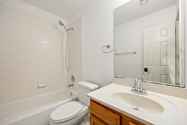 bathroom with toilet, visible vents, washtub / shower combination, and vanity