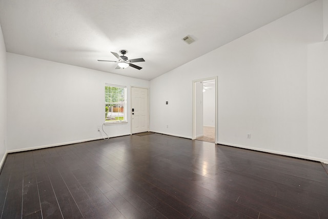 spare room with ceiling fan, baseboards, wood finished floors, lofted ceiling, and visible vents