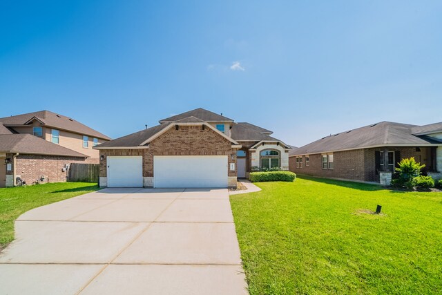 18922 Deer Trace Dr, Crosby, TX 77532 - view of front of home with driveway, brick siding, a front yard, and a garage