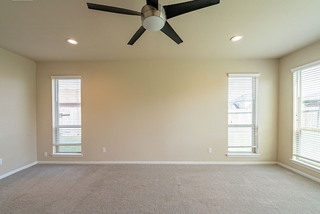 18922 Deer Trace Dr, Crosby, TX 77532 - empty room featuring light carpet, baseboards, and recessed lighting