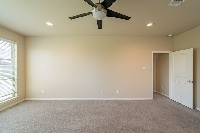 18922 Deer Trace Dr, Crosby, TX 77532 - carpeted spare room with a wealth of natural light, a ceiling fan, visible vents, and baseboards