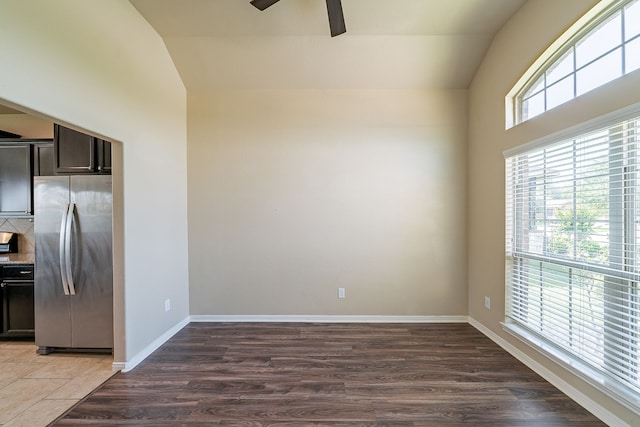 18922 Deer Trace Dr, Crosby, TX 77532 - empty room featuring lofted ceiling, a ceiling fan, wood finished floors, and baseboards
