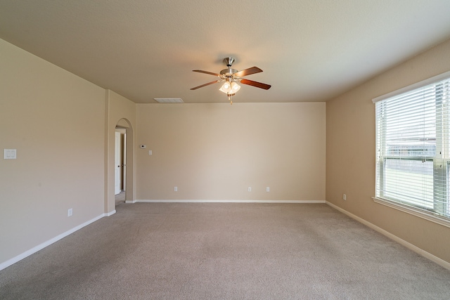 18922 Deer Trace Dr, Crosby, TX 77532 - spare room featuring a ceiling fan, visible vents, a wealth of natural light, and light colored carpet