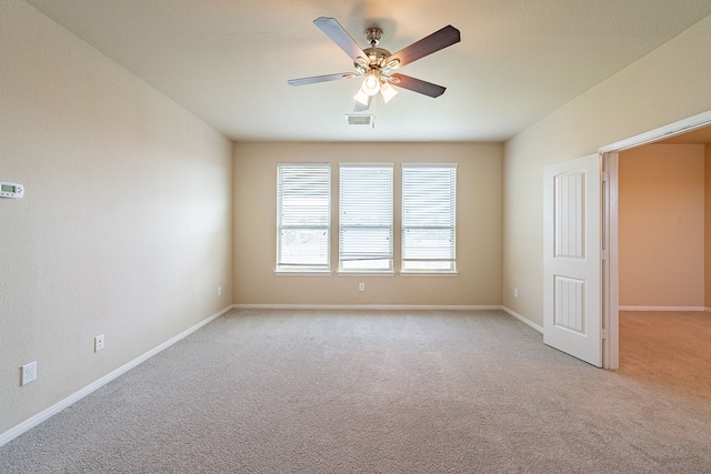 18922 Deer Trace Dr, Crosby, TX 77532 - empty room with baseboards, a ceiling fan, visible vents, and light colored carpet