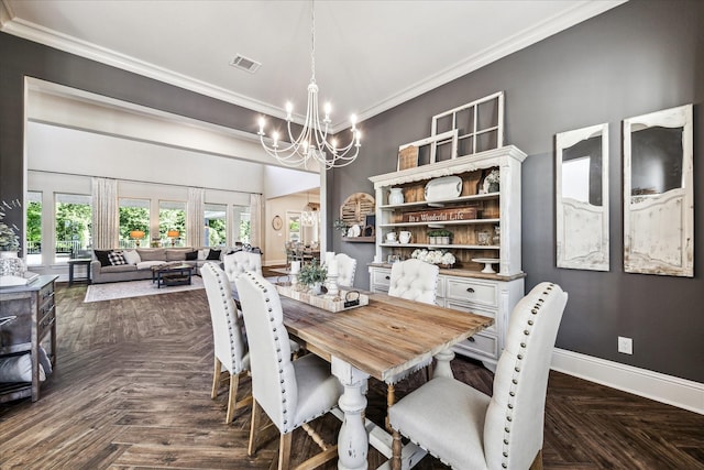 dining area with crown molding, baseboards, visible vents, and a notable chandelier