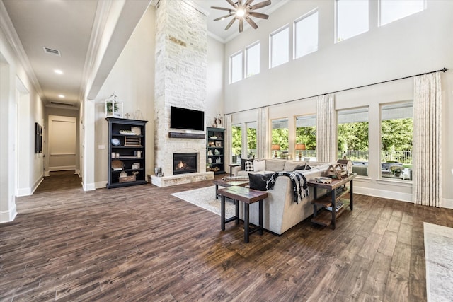 living room with baseboards, dark wood-style floors, and visible vents