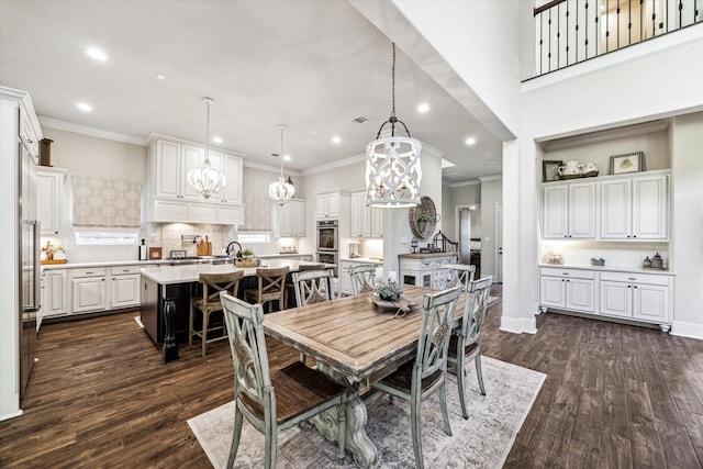 dining space with an inviting chandelier, visible vents, ornamental molding, dark wood-style floors, and recessed lighting