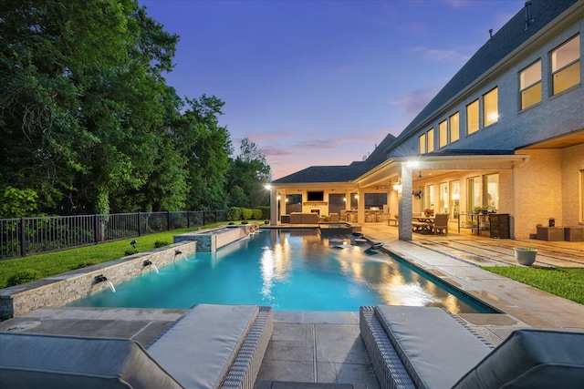 view of pool featuring a pool with connected hot tub, outdoor lounge area, a fenced backyard, and a patio area