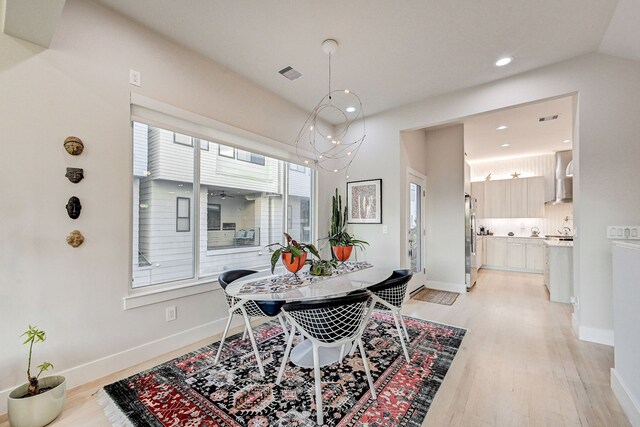 2118 Dennis St, Houston, TX 77004 - dining area with recessed lighting, baseboards, visible vents, and light wood-style flooring