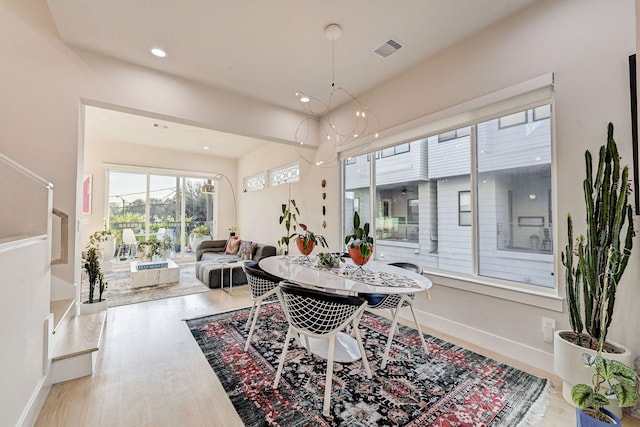2118 Dennis St, Houston, TX 77004 - dining area featuring visible vents, recessed lighting, baseboards, and wood finished floors