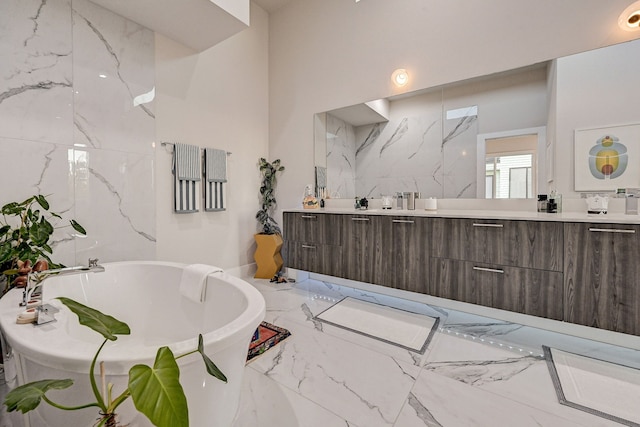 2118 Dennis St, Houston, TX 77004 - bathroom with double vanity, a freestanding bath, and marble finish floor
