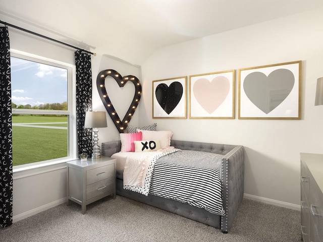 carpeted bedroom with lofted ceiling and baseboards