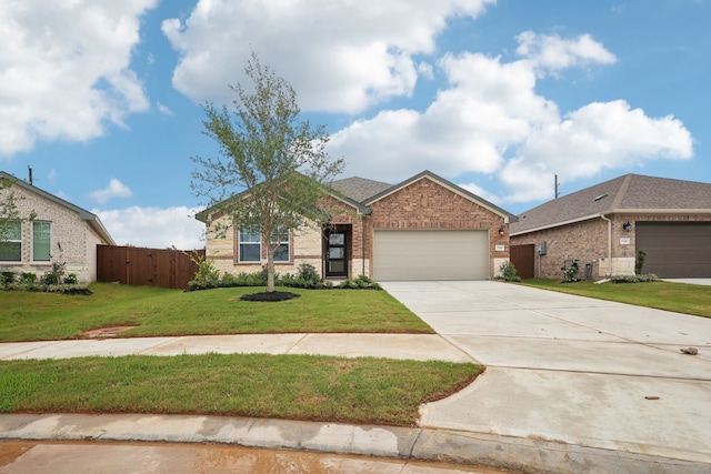 7746 Beaufort Ln, Baytown, TX 77523 - view of front of home with brick siding, a garage, and concrete driveway